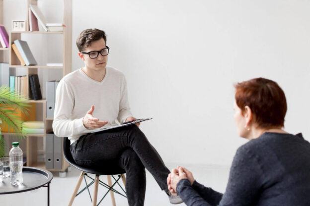 A counselor speaks with a patient during a private alcohol detox consultation.